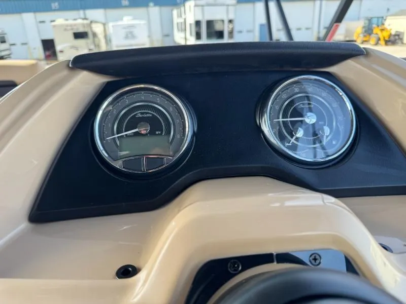 Slide: The Image of Dashboard of 2025 Cabrio Ultra-Entertainer C24UE with dual gauges, outdoor background. - 24