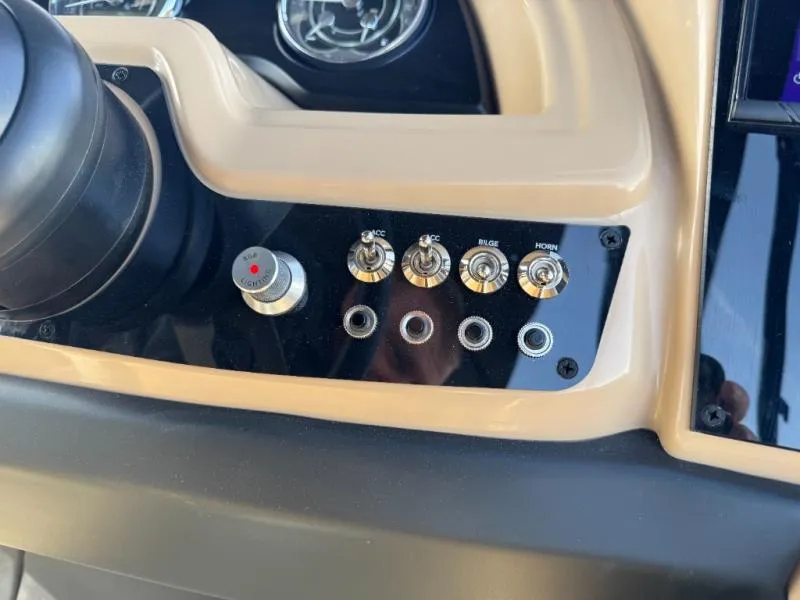 Slide: The Image of Dashboard controls of 2025 Cabrio Ultra-Entertainer C24UE with switches and dials. - 26