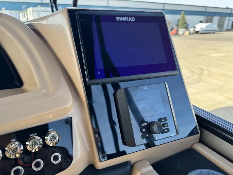 Slide: The Image of Dashboard of 2025 Cabrio Ultra-Entertainer C24UE with Simrad display and controls. - 27