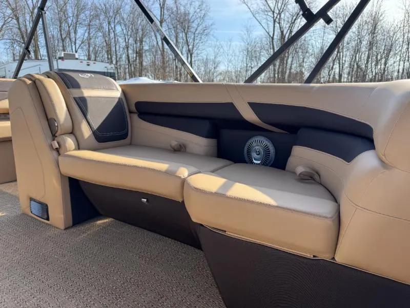 Slide: The Image of Luxurious seating in 2025 Cabrio Ultra-Entertainer C24UE boat, featuring beige and black upholstery. - 29