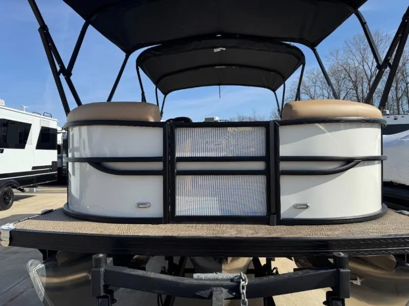 Slide: The Image of 2025 Cabrio Ultra-Entertainer C24UE pontoon boat with canopy, parked outdoors. - 3