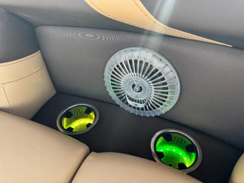 Slide: The Image of Interior of 2025 Cabrio Ultra-Entertainer C24UE with stylish speaker and illuminated cup holders. - 30