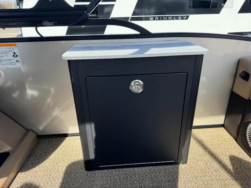 Slide: The Image of 2025 Cabrio Ultra-Entertainer C24UE boat interior with sleek storage cabinet. - 34