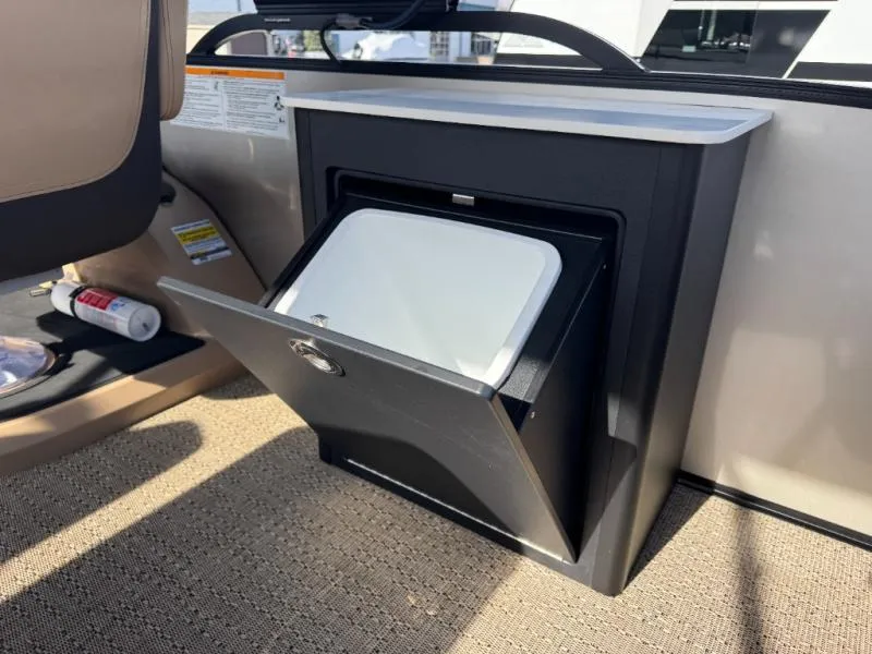 Slide: The Image of 2025 Cabrio Ultra-Entertainer C24UE boat storage compartment with open hatch, beige interior. - 35