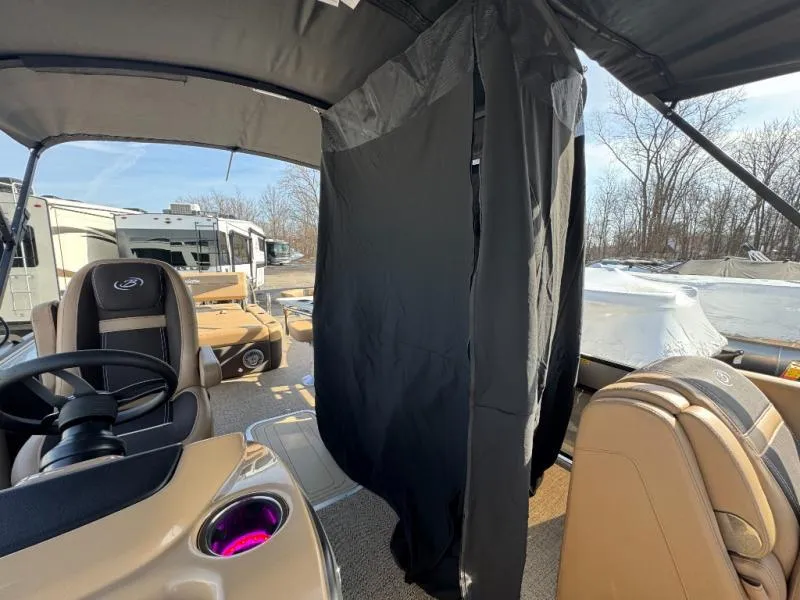 Slide: The Image of 2025 Cabrio Ultra-Entertainer C24UE interior with steering wheel and privacy curtain. - 36