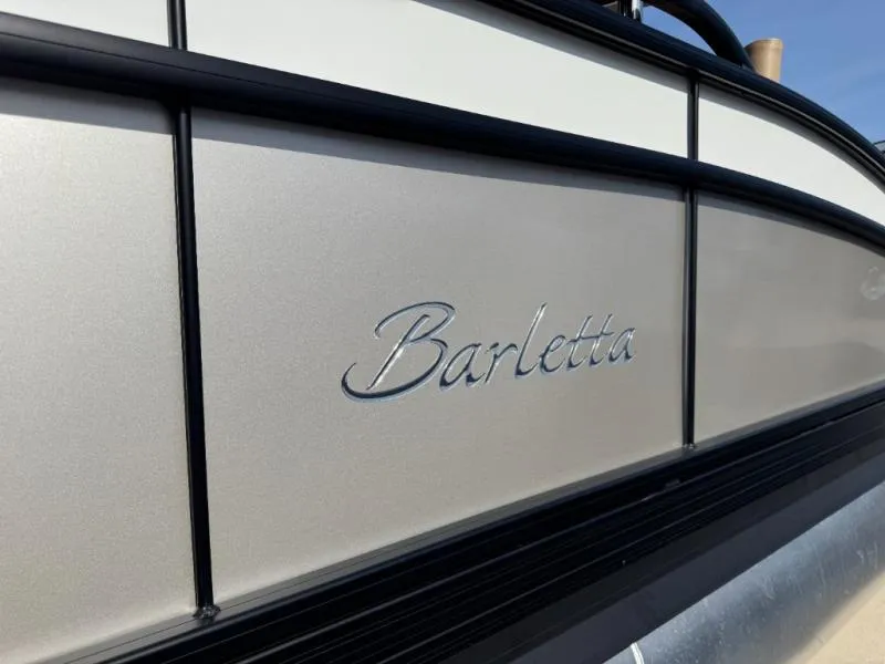 Slide: The Image of 2025 Cabrio Ultra-Entertainer C24UE boat with Barletta branding on metallic exterior. - 6