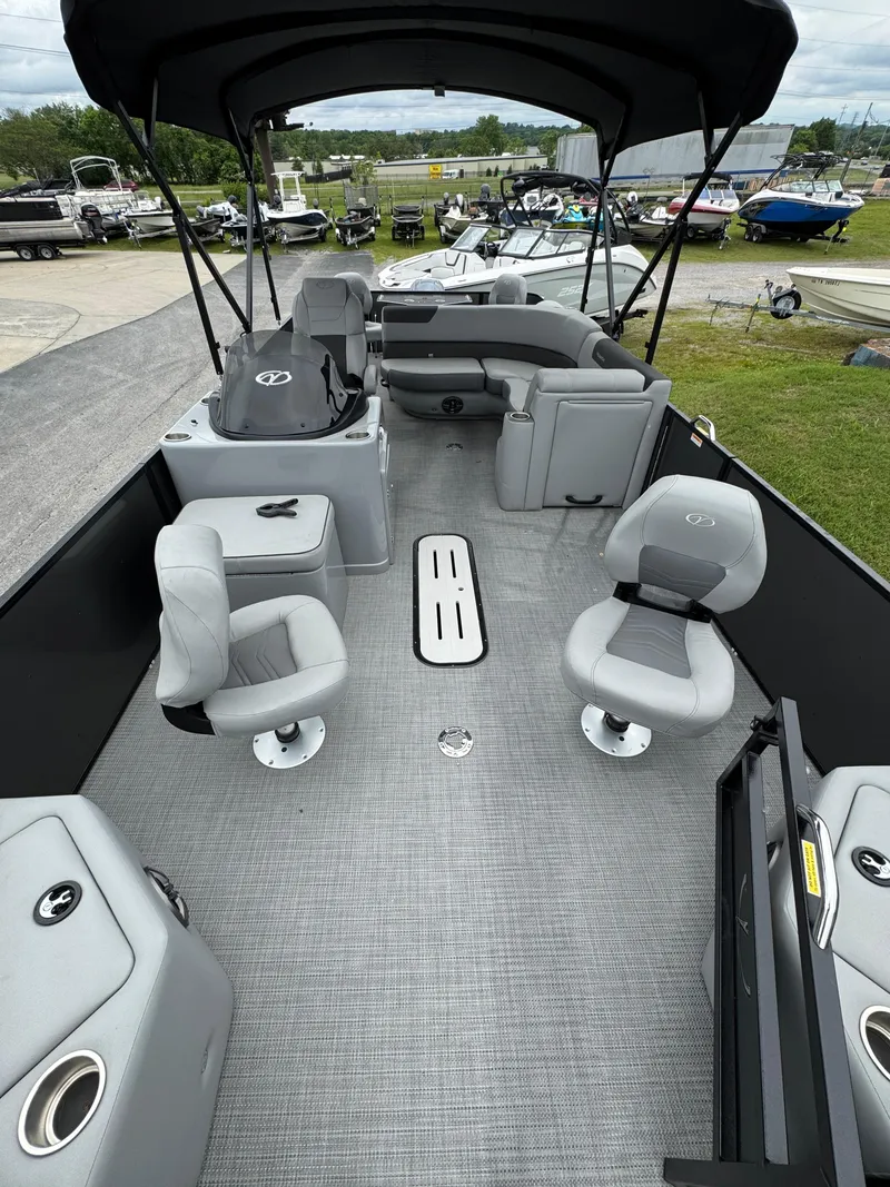 Slide: The Image of 2025 Veranda Fish VF22F4 pontoon boat interior with gray seating and canopy. - 3