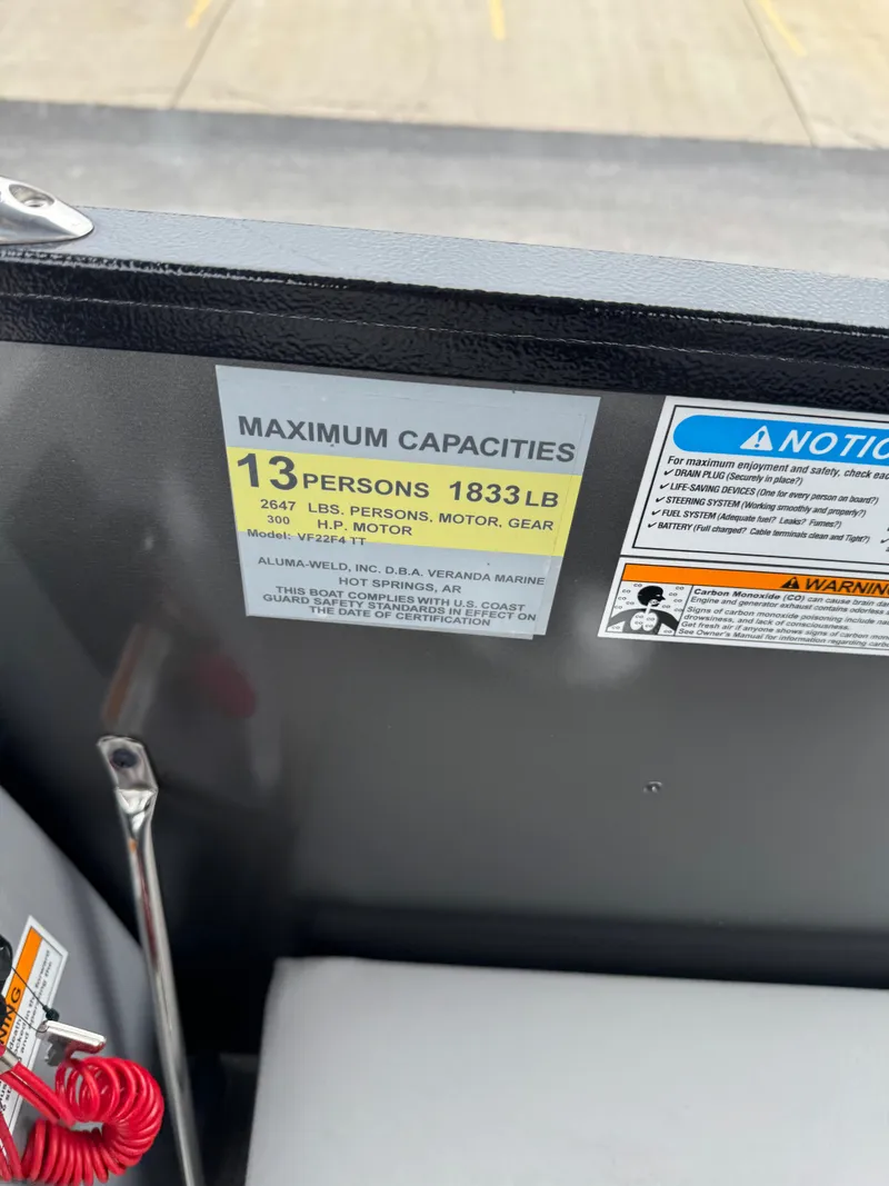 Slide: The Image of Capacity label on Veranda Fish VF22F4 boat, 2025 model, showing 13 persons or 1833 lbs limit. - 6