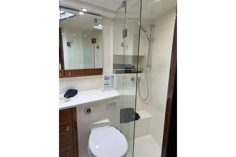 Slide: The Image of Luxurious bathroom in 2020 Maritimo M51 yacht with glass shower and modern fixtures. - 111