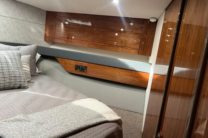 Slide: The Image of Luxurious cabin interior of 2020 Maritimo M51 yacht with wood finishes and cozy bedding. - 114