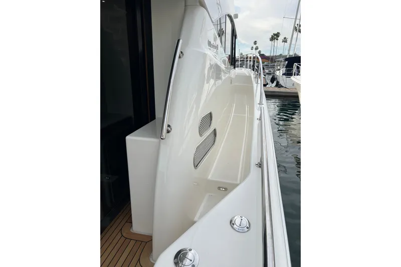 Slide: The Image of 2020 Maritimo M51 yacht side deck with sleek design and stainless steel railings. - 84