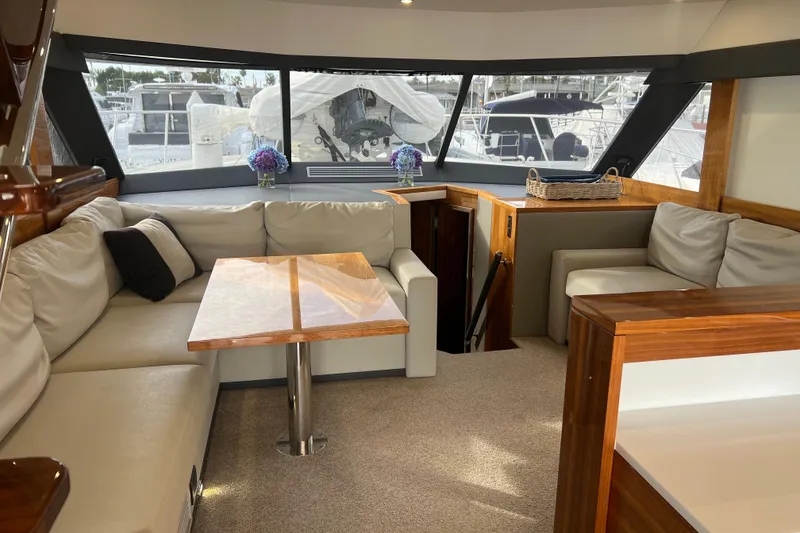 Slide: The Image of Luxurious interior of 2020 Maritimo M51 yacht with elegant seating and wooden accents. - 86