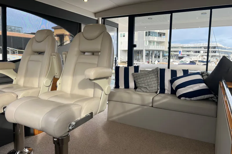 Slide: The Image of Luxurious interior of 2020 Maritimo M51 yacht with plush seating and striped cushions. - 91