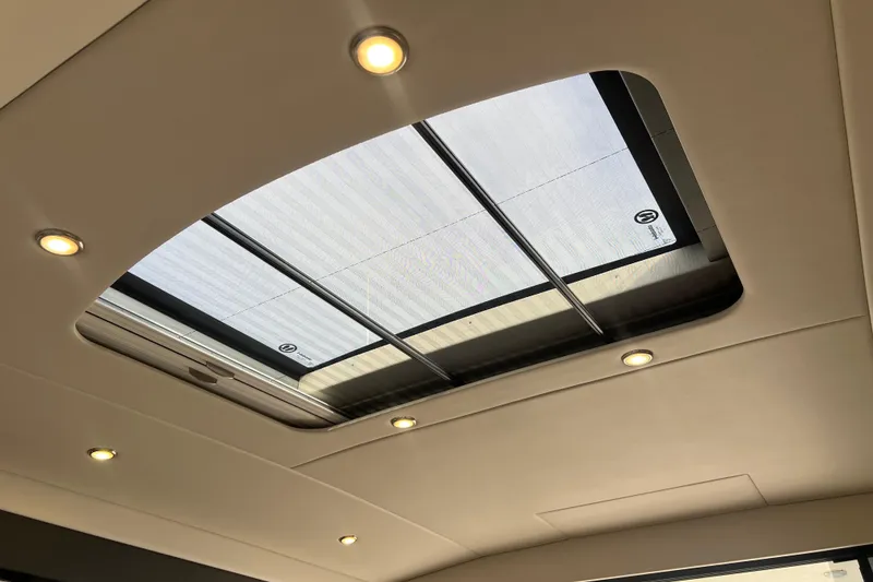 Slide: The Image of 2020 Maritimo M51 yacht interior with skylight and recessed lighting. - 94