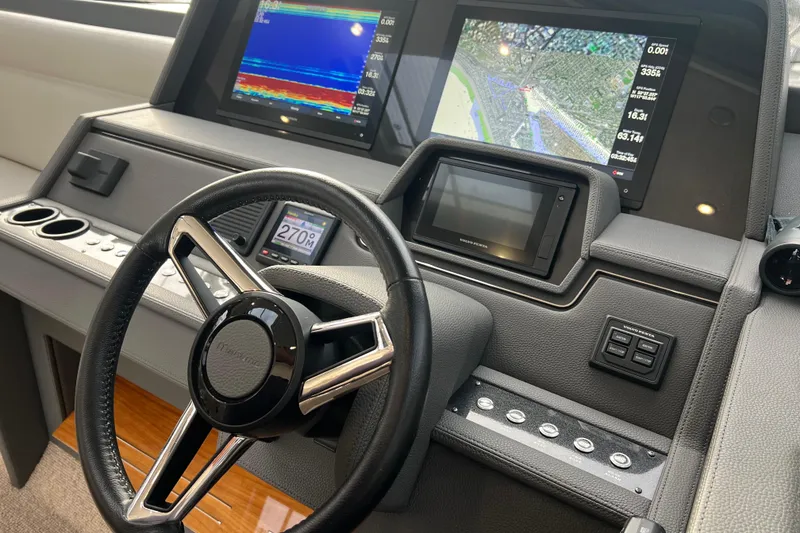 Slide: The Image of Helm of 2020 Maritimo M51 yacht with advanced navigation displays and controls. - 95
