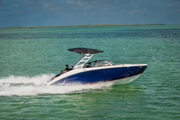 Slide: The Image of 2025 Yamaha Boats 252SD cruising on clear turquoise waters. - 10