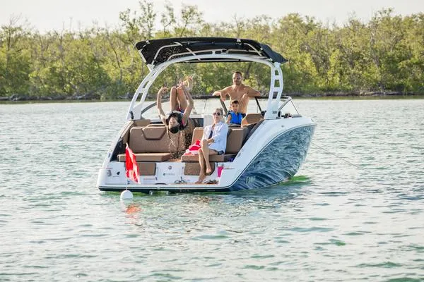 Slide: The Image of 2025 Yamaha Boats 252SD on water with people enjoying leisure activities. - 2