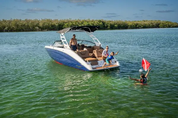 Slide: The Image of 2025 Yamaha Boats 252SD on clear water with people enjoying a sunny day. - 3