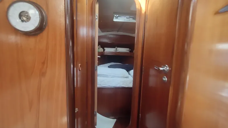 Slide: The Image of Cozy cabin interior of 1990 Beneteau Oceanis 390 sailboat with wooden finish. - 24