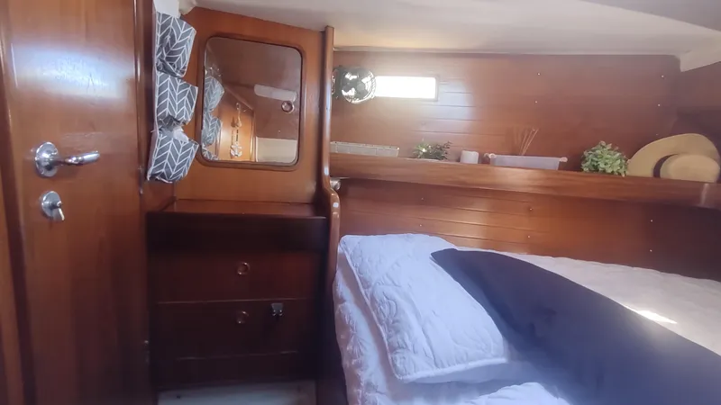 Slide: The Image of Cozy cabin interior of 1990 Beneteau Oceanis 390 sailboat with wooden furnishings. - 27