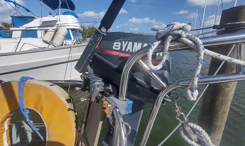 Slide: The Image of Beneteau Oceanis 390 sailboat with Yamaha outboard motor, docked at marina, 1990 model. - 39