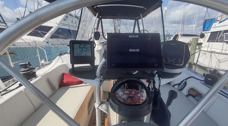 Slide: The Image of Cockpit of 1990 Beneteau Oceanis 390 sailboat with navigation instruments and compass. - 4