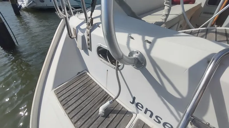 Slide: The Image of Beneteau Oceanis 390 sailboat deck, 1990 model, featuring a shower and wooden flooring. - 41