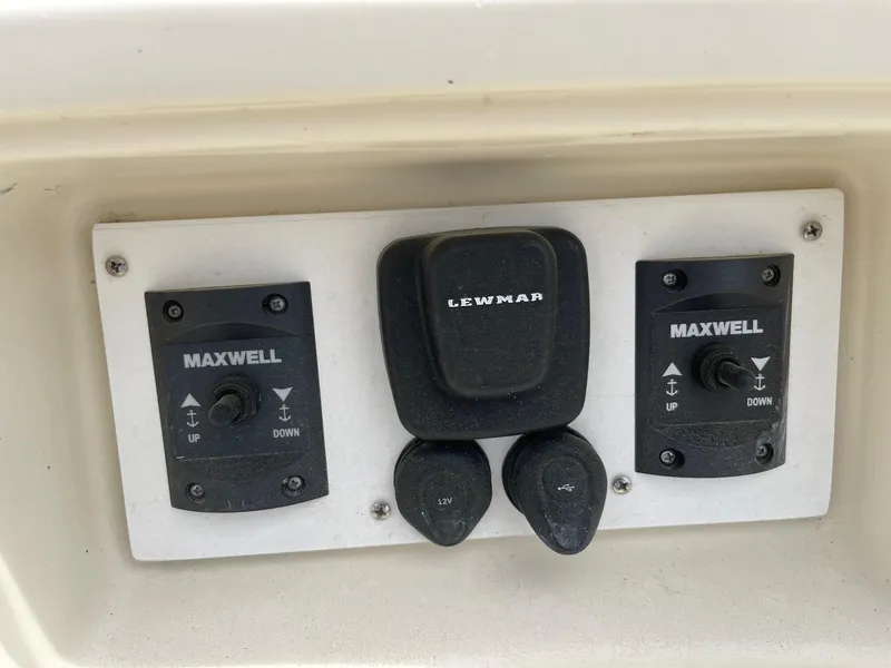 Slide: The Image of Control panel of a 2005 Hake Seaward 32RK boat with Maxwell and Lewmar switches. - 10