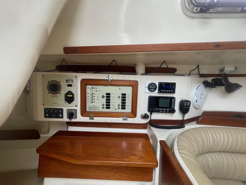 Slide: The Image of 2005 Hake Seaward 32RK sailboat interior with navigation panel and seating area. - 17