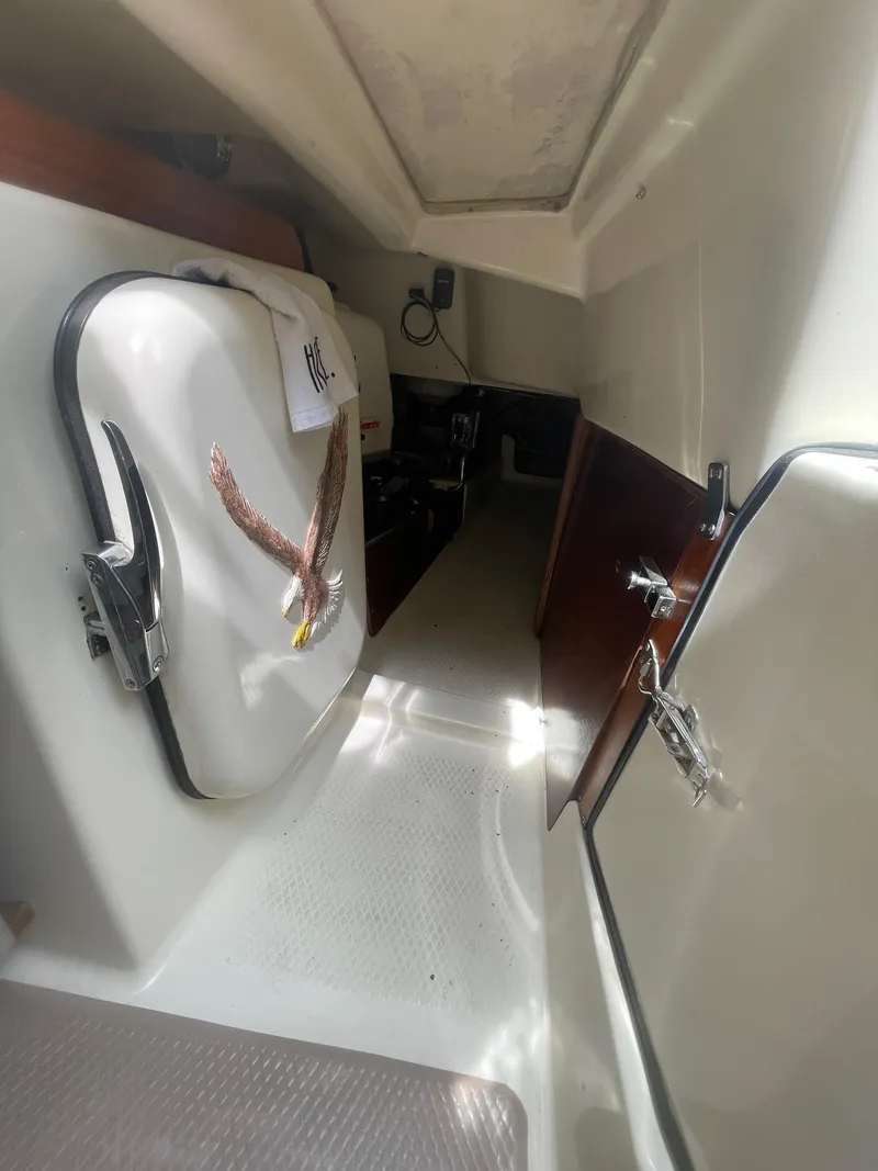Slide: The Image of 2005 Hake Seaward 32RK cabin interior with white and wood finishes. - 21