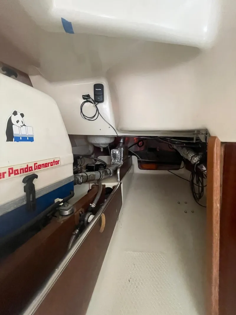 Slide: The Image of 2005 Hake Seaward 32RK interior with generator and mechanical components. - 22