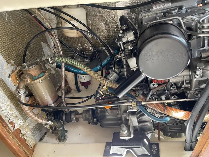 Slide: The Image of Engine compartment of a 2005 Hake Seaward 32RK sailboat, showing mechanical components and wiring. - 24