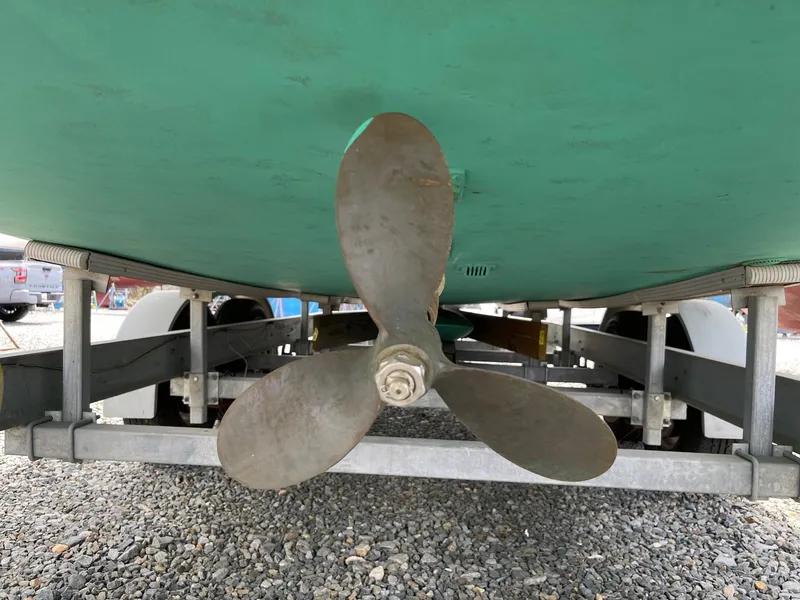 Slide: The Image of Propeller of 2005 Hake Seaward 32RK boat on trailer, gravel ground. - 28