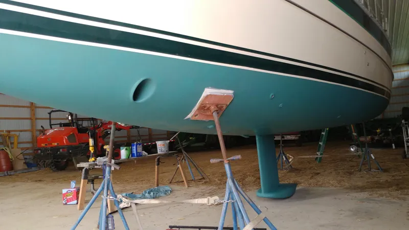 Slide: The Image of 2005 Hake Seaward 32RK sailboat in a workshop, supported by stands. - 8