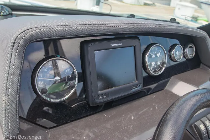 Slide: The Image of Dashboard of 2018 Monterey MX6 Surf Edition boat with Raymarine display and gauges. - 13