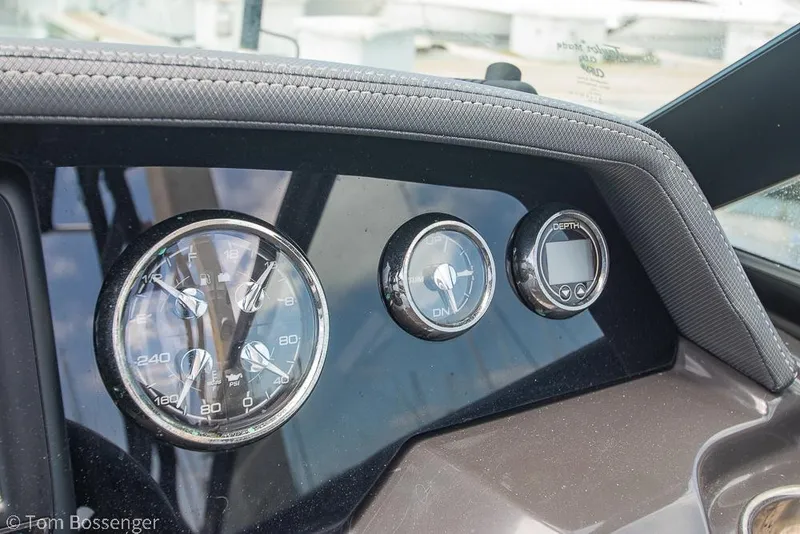 Slide: The Image of Dashboard of 2018 Monterey MX6 Surf Edition boat with gauges and depth meter. - 15