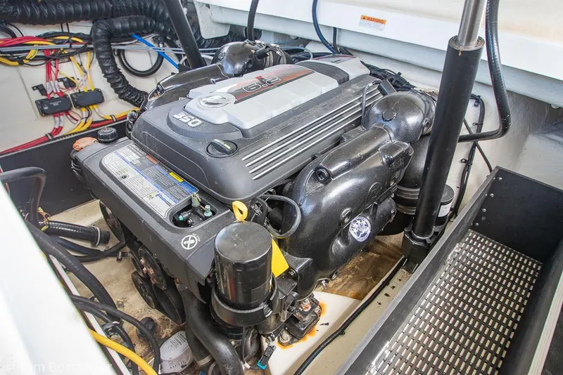 Slide: The Image of Engine compartment of a 2018 Monterey MX6 Surf Edition boat, showcasing detailed components. - 27