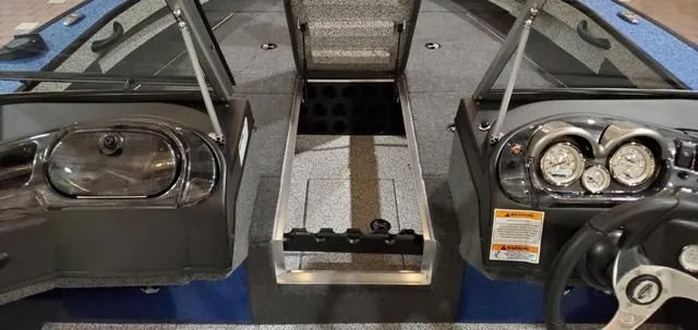 Slide: The Image of 2023 Polar Kraft Kodiak Sport 185 FS boat interior with dual consoles and storage compartment. - 13