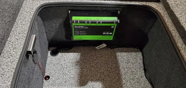 Slide: The Image of 2023 Polar Kraft Kodiak Sport 185 FS battery compartment with RealPRO charger. - 14