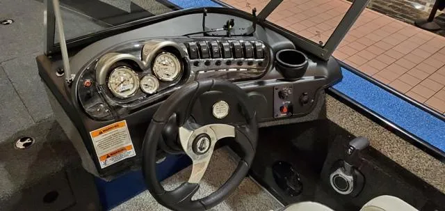 Slide: The Image of 2023 Polar Kraft Kodiak Sport 185 FS dashboard with steering wheel and gauges. - 6