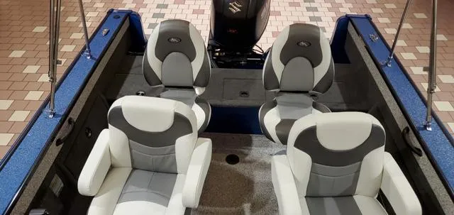 Slide: The Image of 2023 Polar Kraft Kodiak Sport 185 FS boat interior with four cushioned seats. - 8