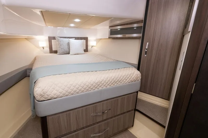 Slide: The Image of 2026 Regal 36 Grande Coupe interior with luxurious seating in a showroom setting. - 22