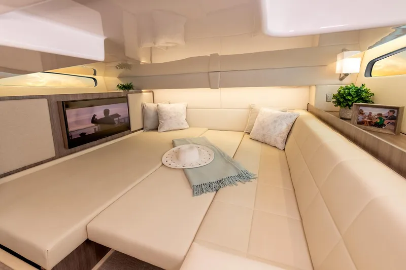 Slide: The Image of Interior of 2026 Regal 36 Grande Coupe with TV, cabinet, and bed. - 24