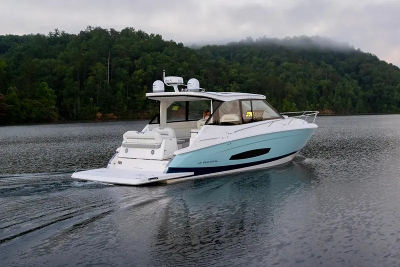 Slide: The Image of 2026 Regal 36 Grande Coupe boat displayed indoors, showcasing sleek design and modern features. - 5
