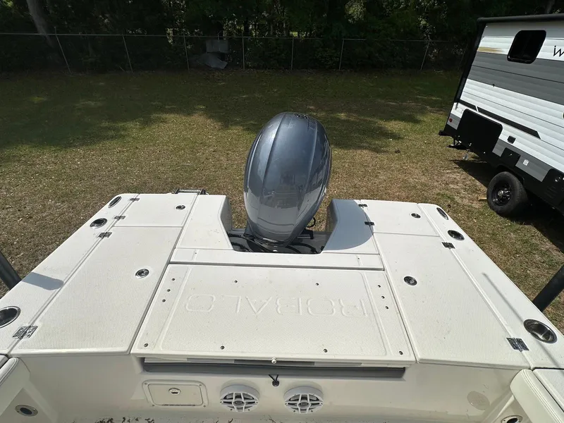 Slide: The Image of 2023 Robalo 226 Cayman boat with outboard motor, viewed from above. - 9