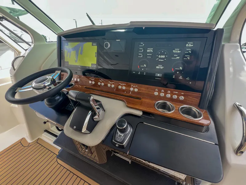 Slide: The Image of 2023 Tiara Yachts 38 LS helm with advanced navigation and control systems. - 13