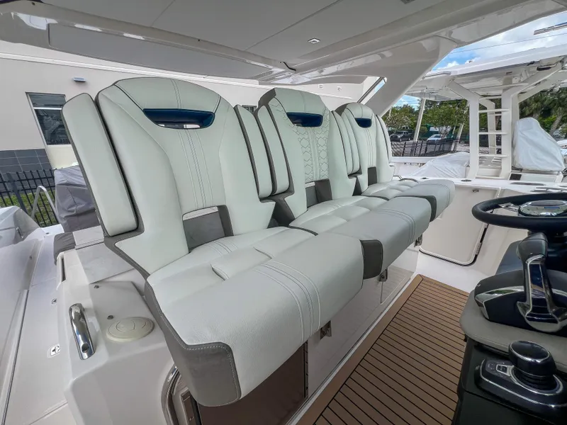 Slide: The Image of 2023 Tiara Yachts 38 LS interior with luxurious seating and modern helm controls. - 19