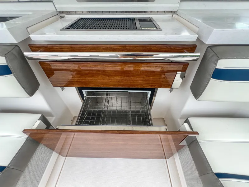 Slide: The Image of 2023 Tiara Yachts 38 LS interior with open wooden cabinetry and modern appliances. - 24