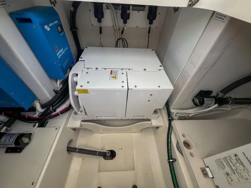 Slide: The Image of 2023 Tiara Yachts 38 LS engine compartment with electrical components and wiring. - 27