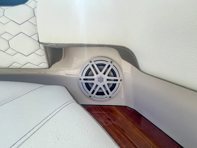 Slide: The Image of Speaker detail on 2023 Tiara Yachts 38 LS, featuring white upholstery and wood accents. - 5